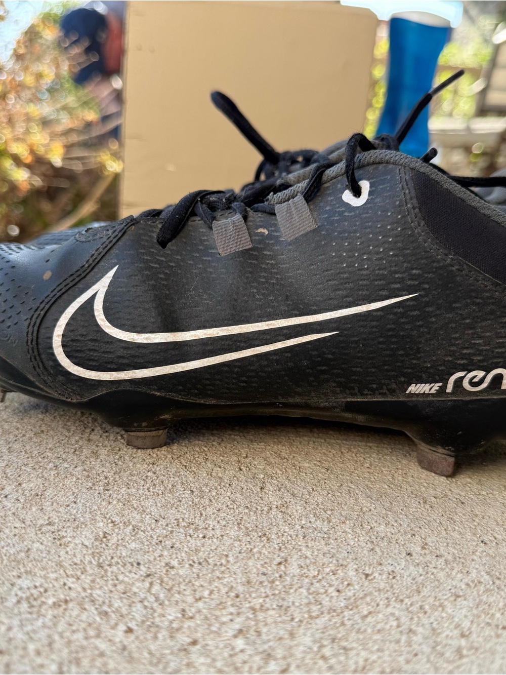 Nike Women’s Black Athletic Cleats with White Swoosh- metal